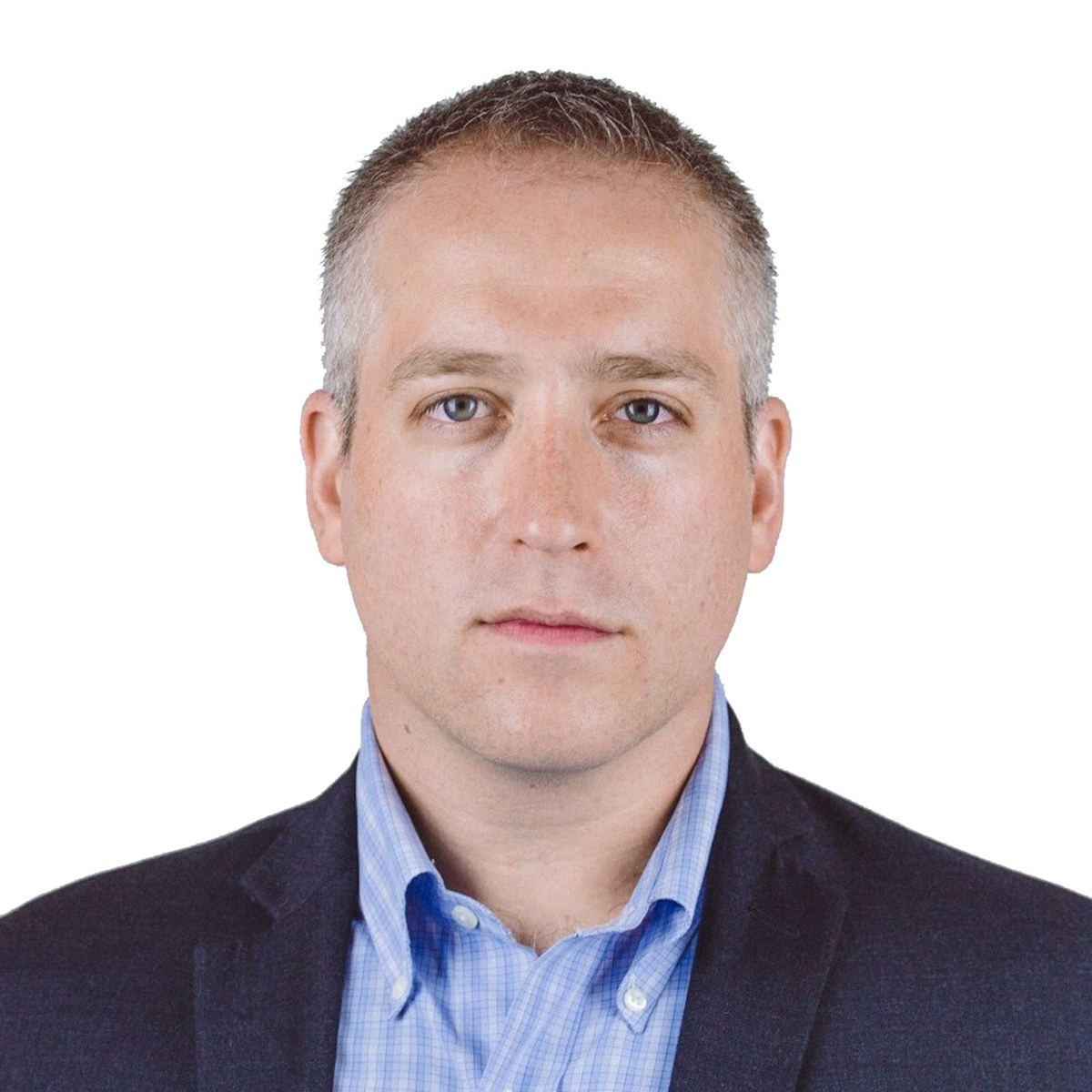Adam Zuckerman, in a navy blazer and blue shirt